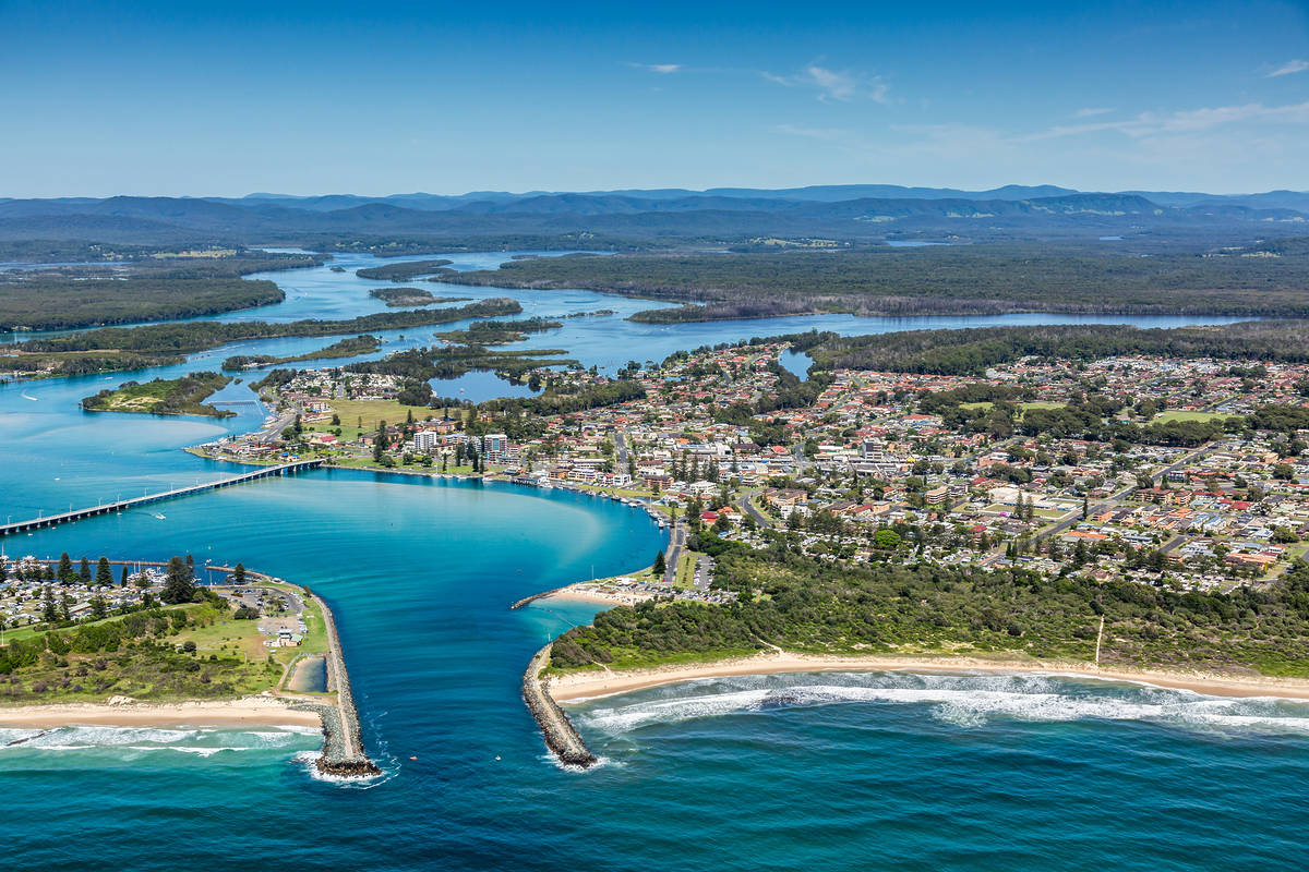 Aerial of Forster with Wallis Lake meeting the Pacific Ocean with turquoise waterways and sandbars