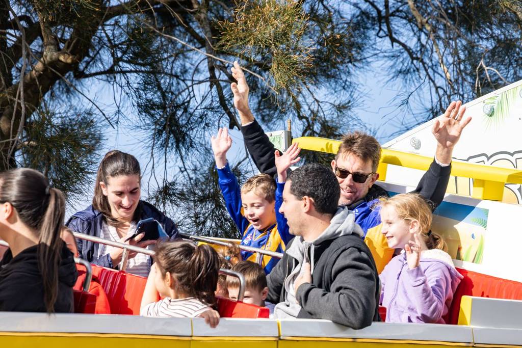family at the Sydney Greek Summer Festival riding a ride