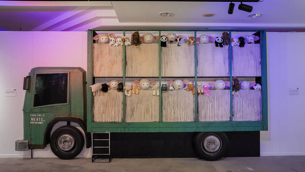 Banksy's truck full of wailing animals at Banksy Limitless.