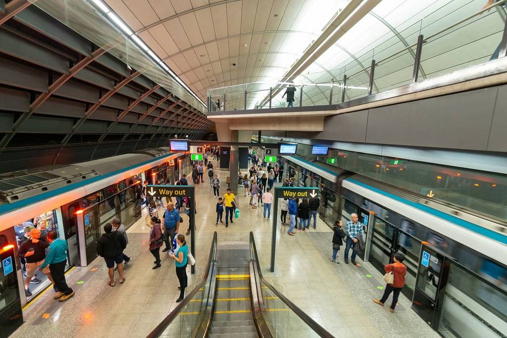 people boarding trains at sydney metro