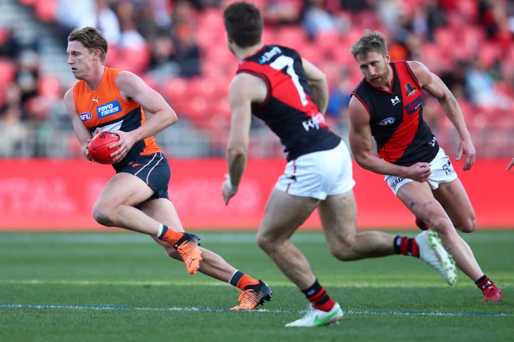 SYDNEY, AUSTRALIA - AUGUST 06: Lachie Whitfield of the Giants runs the ball during the round 21 AFL match between the Greater Western Sydney Giants and the Essendon Bombers at GIANTS Stadium on August 06, 2022 in Sydney, Australia.