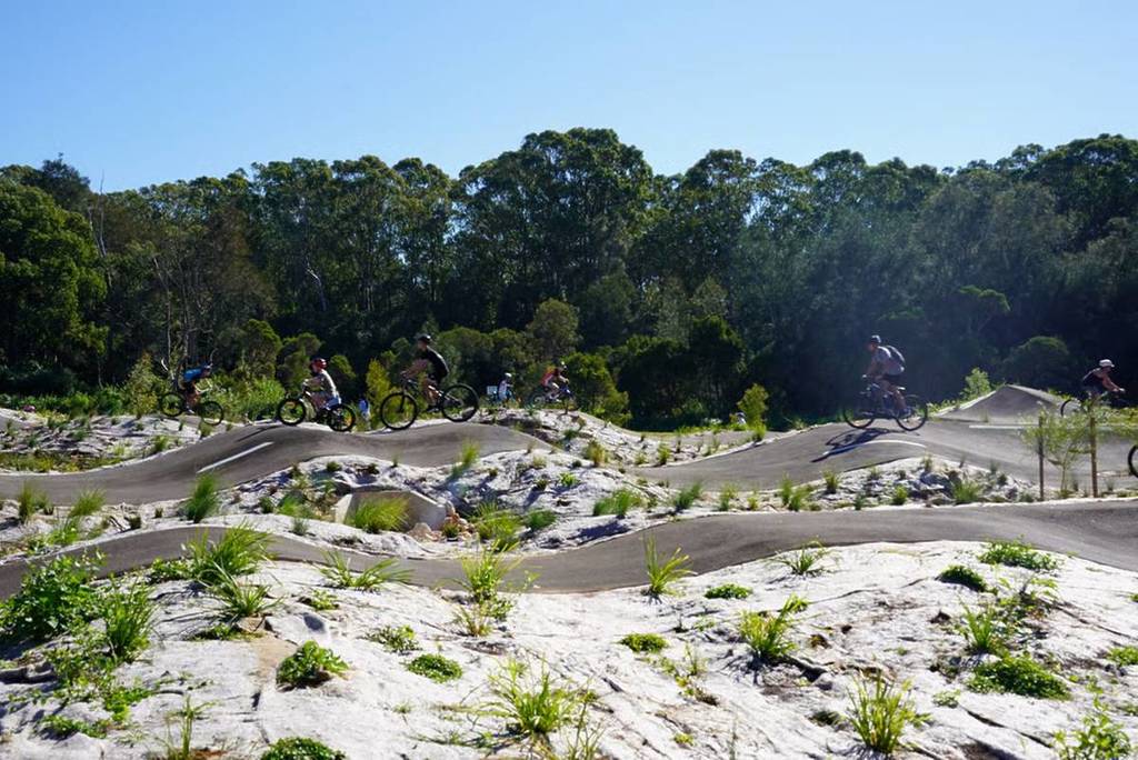 kids racing at deepwater pump track