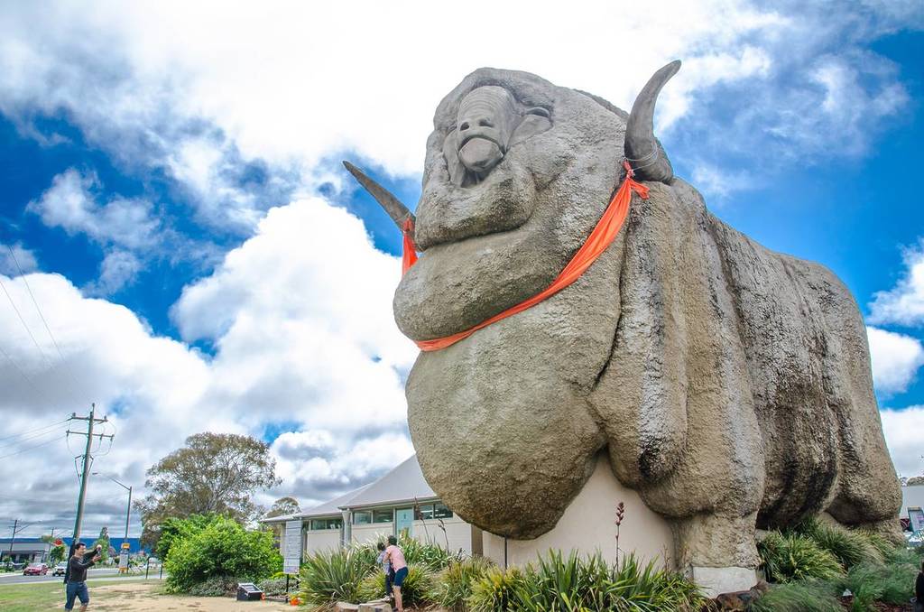 A large, concrete sculpture of a ram known as The Big Merino in Australia under a cloudy sky