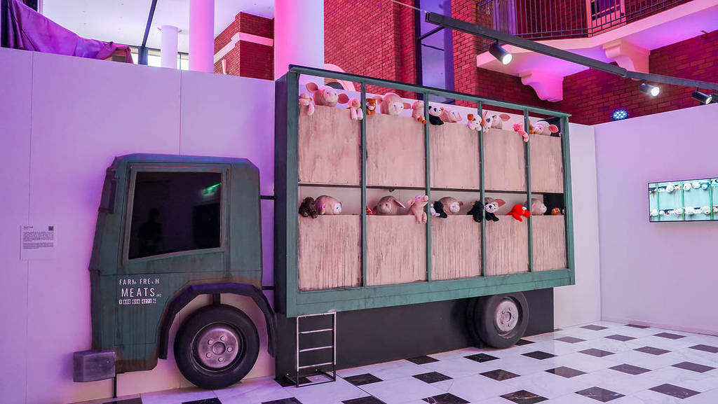 Banksy's work, "Sirens of the Lambs", featuring a slaughterhouse delivery truck filled with stuffed animals.