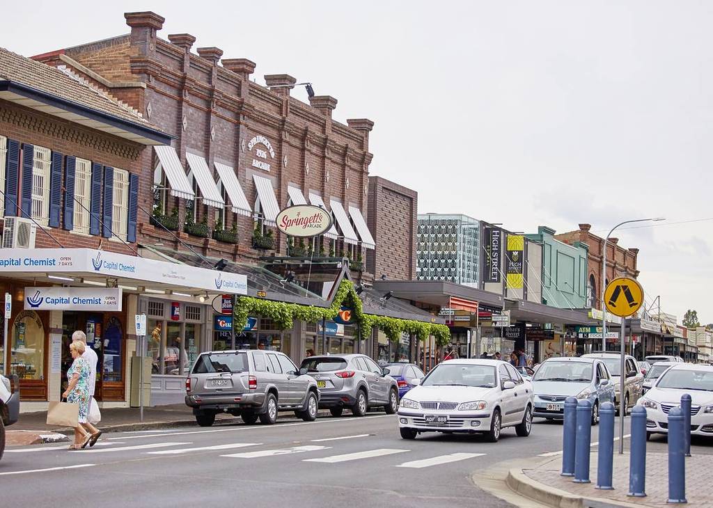 Historic shopfronts and heritage buildings lining Bong Bong Street in Bowral