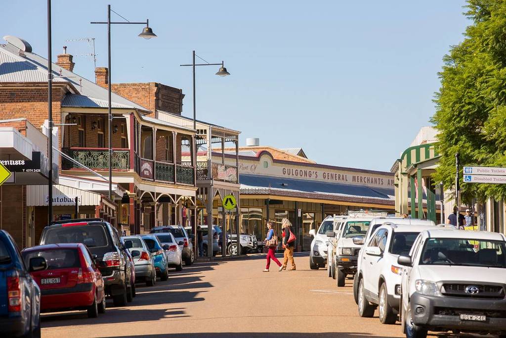 Historic main street in Gulgong lined with heritage shopfronts and country buildings in regional NSW