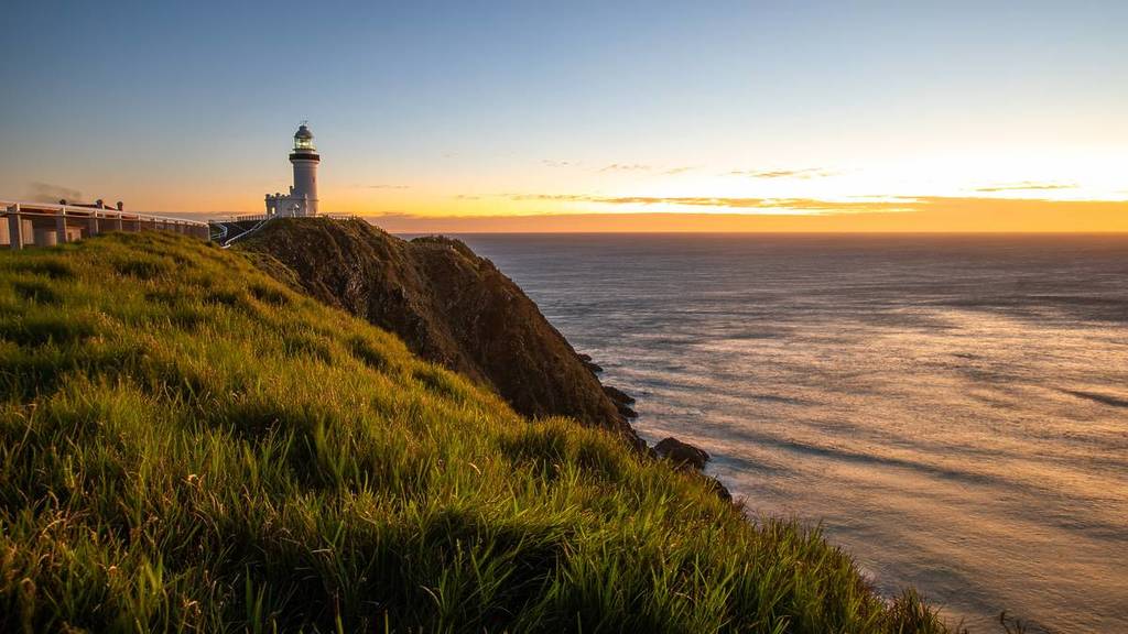 Cape Byron Lighthouse overlooking the ocean at sunset in Byron Bay on the NSW North Coast