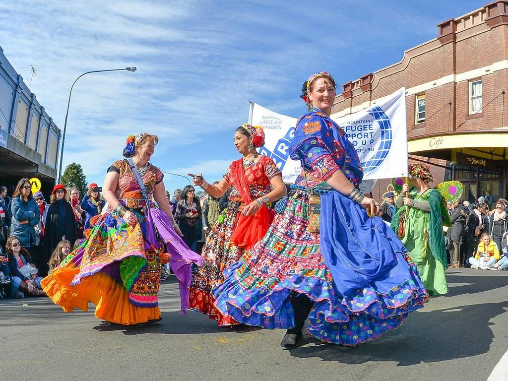Performers in colourful costumes take part in a street parade during the Winter Magic Festival in Katoomba