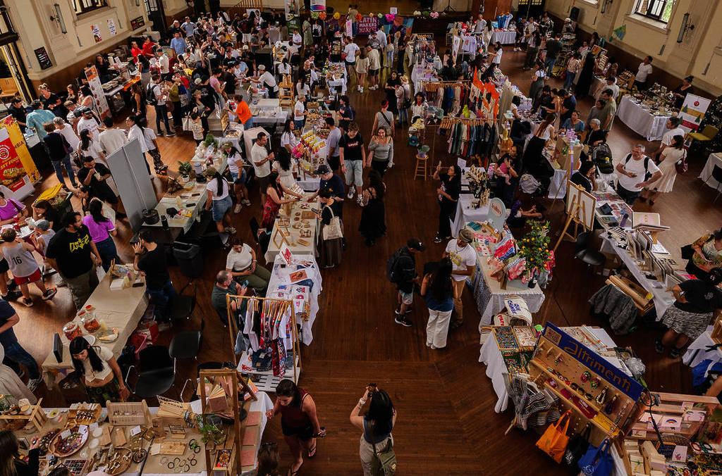 Crowds browse stalls at the Winter Latin Makers Market inside Marrickville Town Hall in Sydney