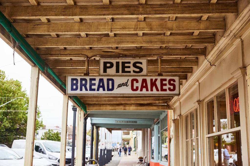 Vintage bakery signage beneath historic verandahs in central Braidwood