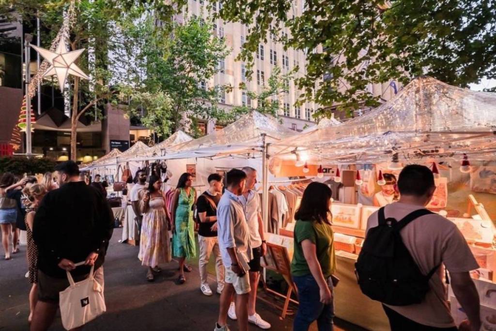 Visitors browse artisan market stalls at Parramatta's Midwinter Festival in Parramatta Square