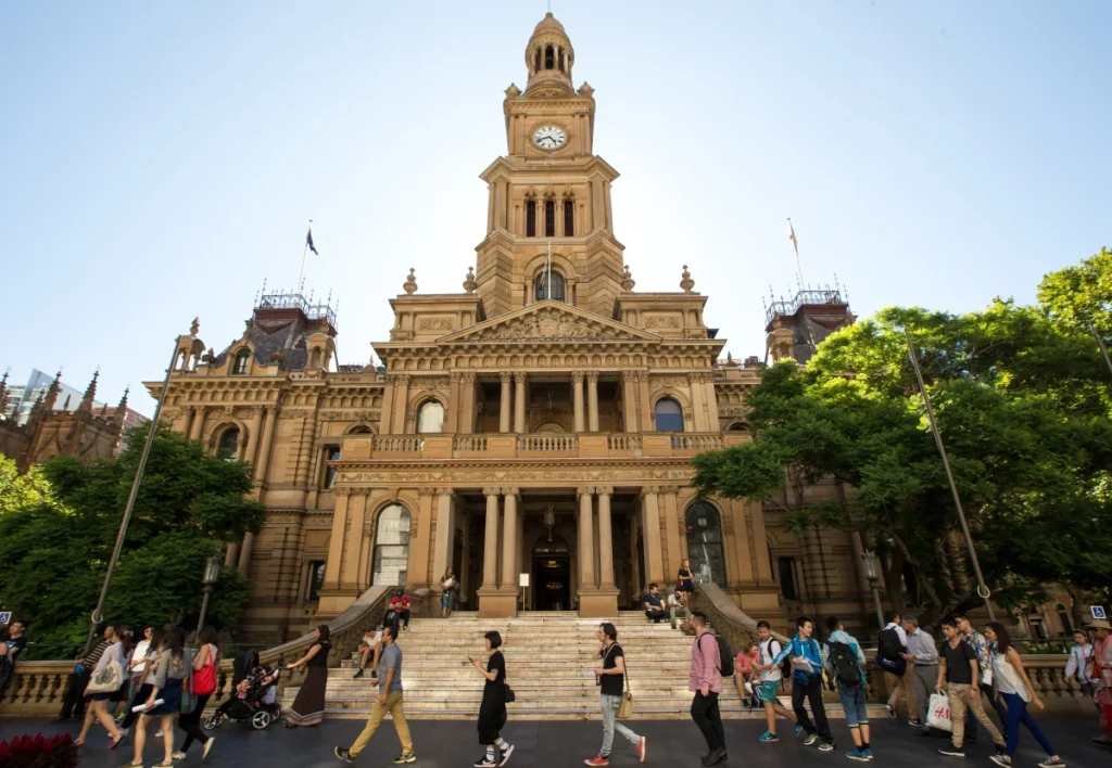 Sydney Town Hall and pedestrians in the CBD, where a major new public square is planned opposite the historic building