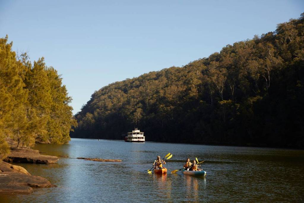 Kayakers on the Nepean River surrounded by bushland near the future Gulguer National Park in Western Sydney