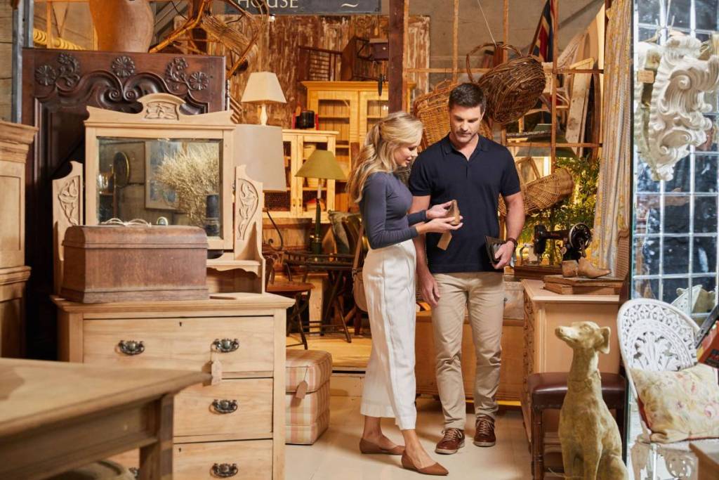 Visitors browsing vintage furniture and antiques inside Dirty Janes in Bowral