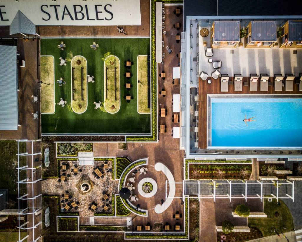 A birds eye view of in Sydney including a swimming pool and outodoor seating area