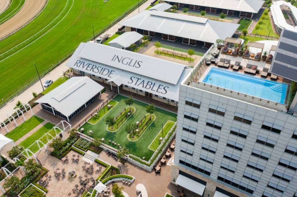 An outdoor view of The William Inglis Hotel Warwick Farm with views of the stables and outdoor pool