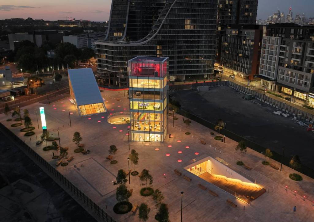 Aerial view of Green Square Plaza at dusk surrounded by modern apartment buildings in Sydney