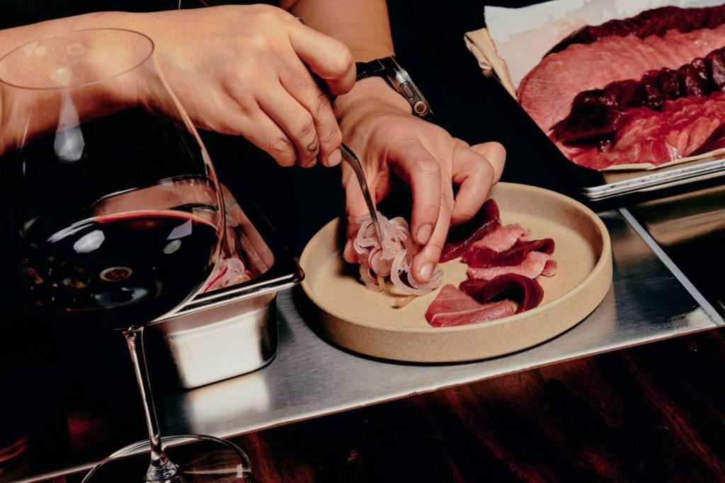 chef preparing dish at Aenza, Japanese wine bar in Sydney