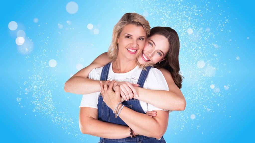 Sophie hugs Diana from behind in a promotional shot for Mamma Mia!