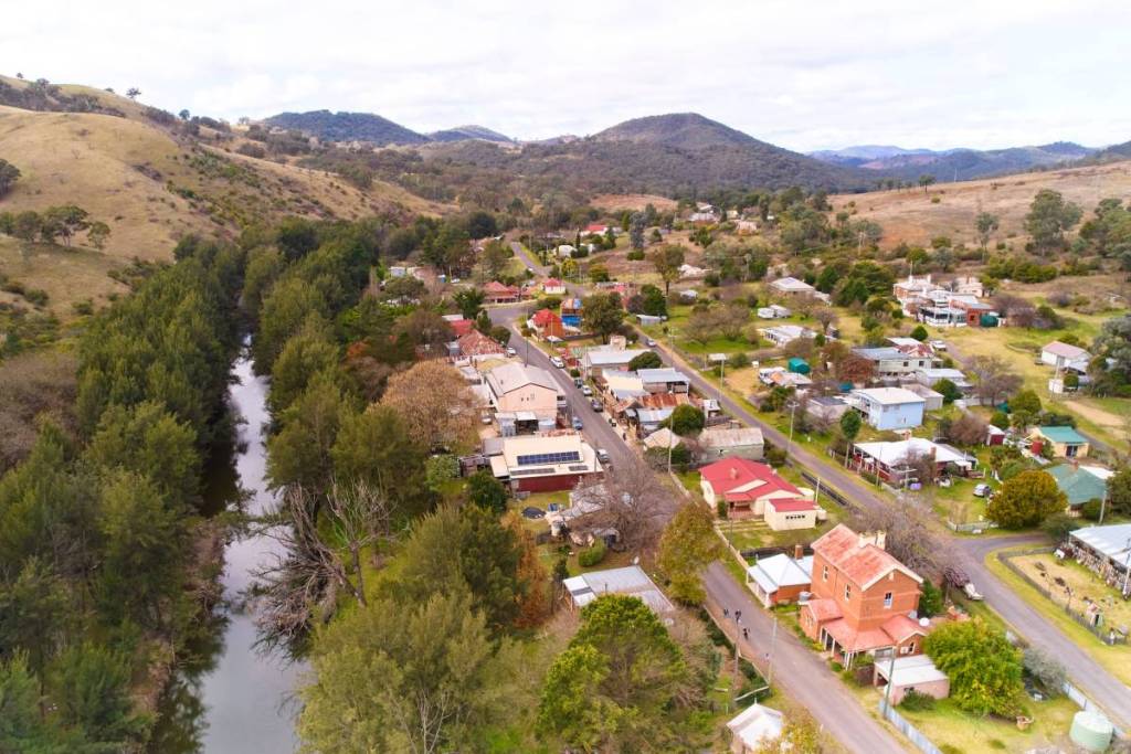 Aerial view of Sofala's historic main street winding alongside the Turon River in NSW