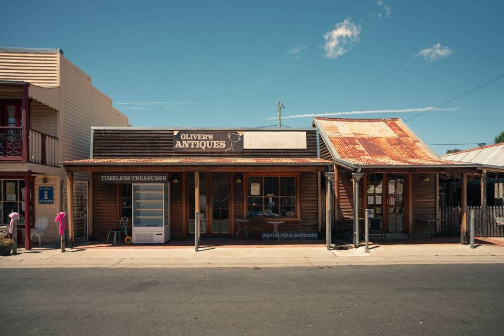 Historic shopfronts, including an antique store, along Sofala's heritage main street in regional NSW