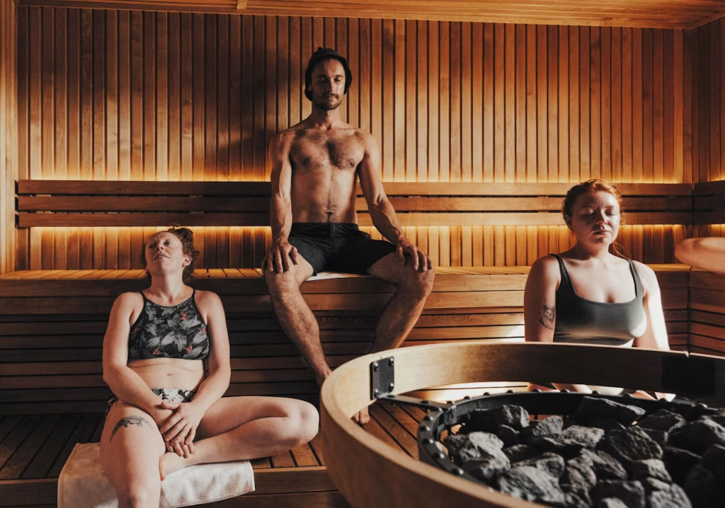 Visitors relaxing inside a wood-fired sauna at Blue Mountains Sauna in Leura during The Big Sweat festival