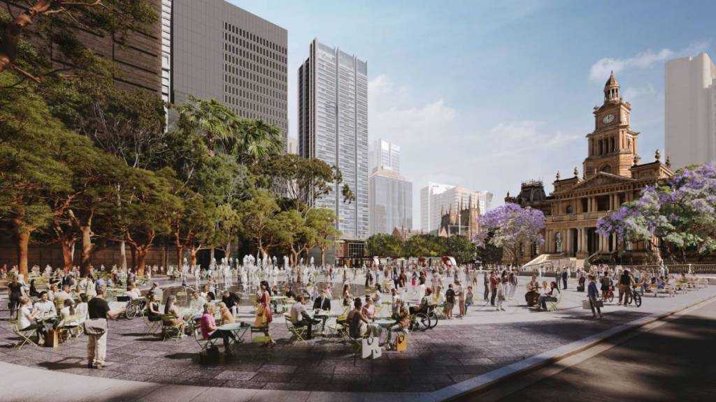 People in the CBD seated near the town hall square in Sydney