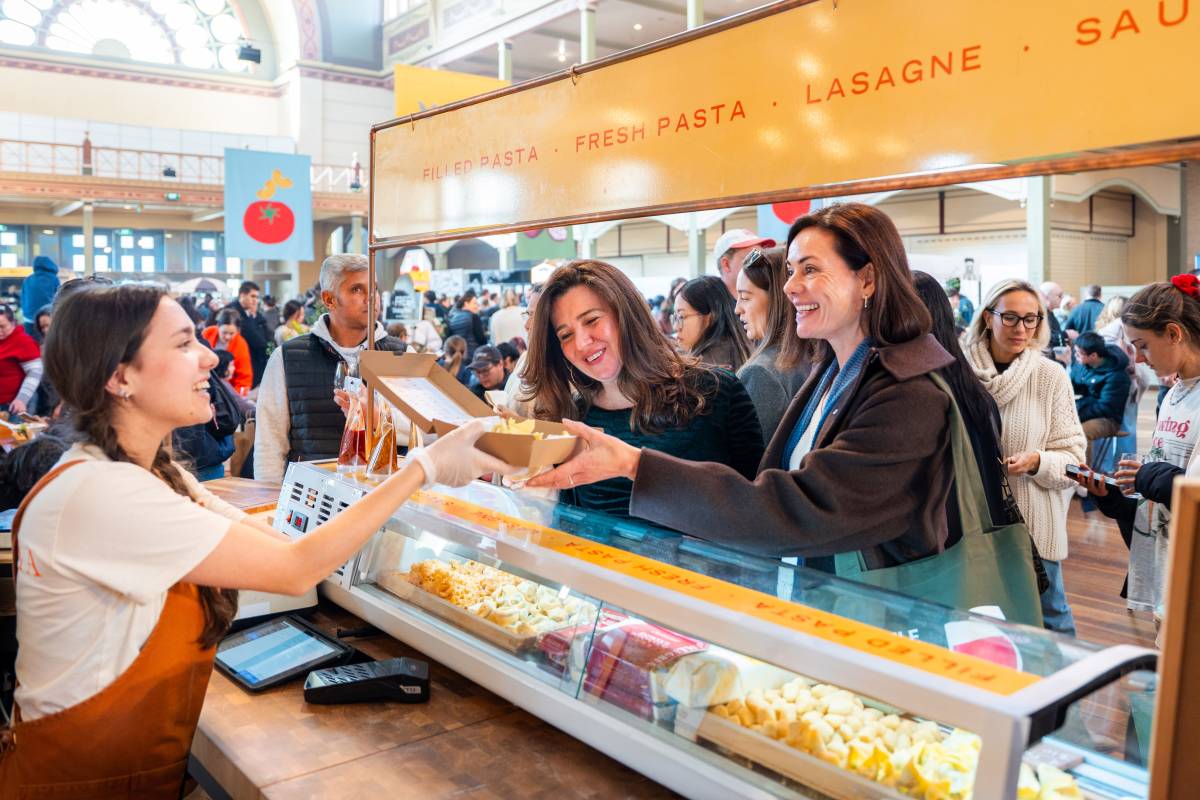 Shoppers buy fresh pasta from a vendor at The Little Food Market in Melbourne