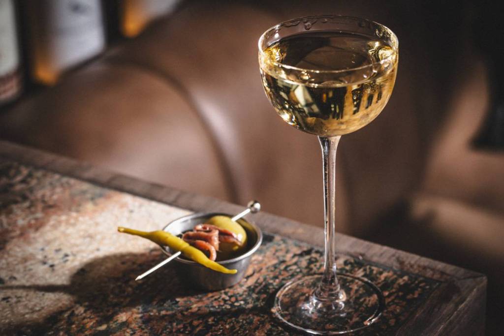 a martini and a gilda on a table 