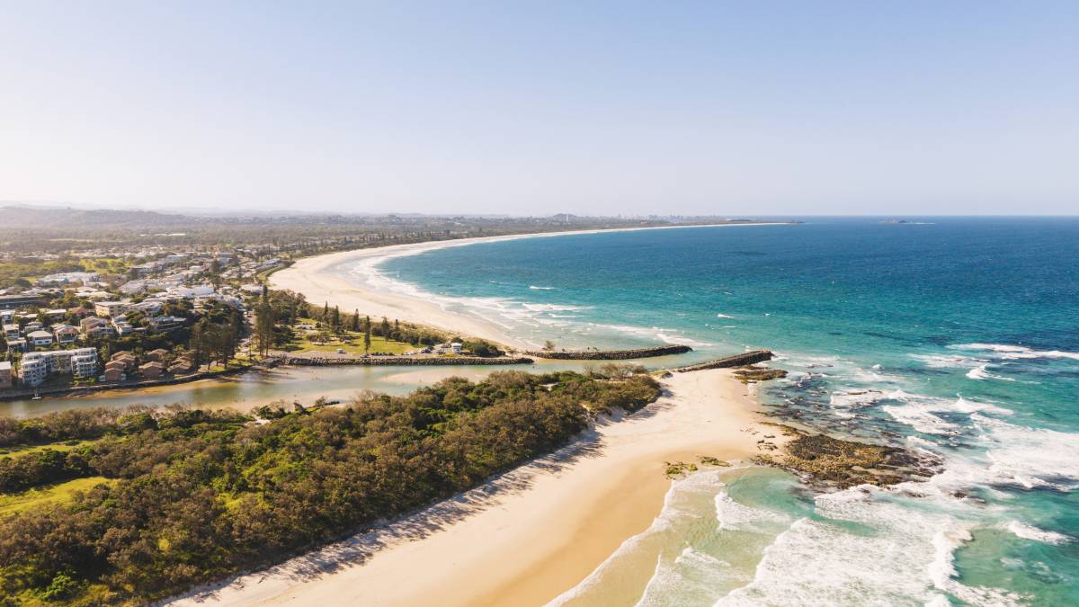 Aerial view of Kingscliff’s coastline, with golden beaches, turquoise ocean water and Cudgen Creek