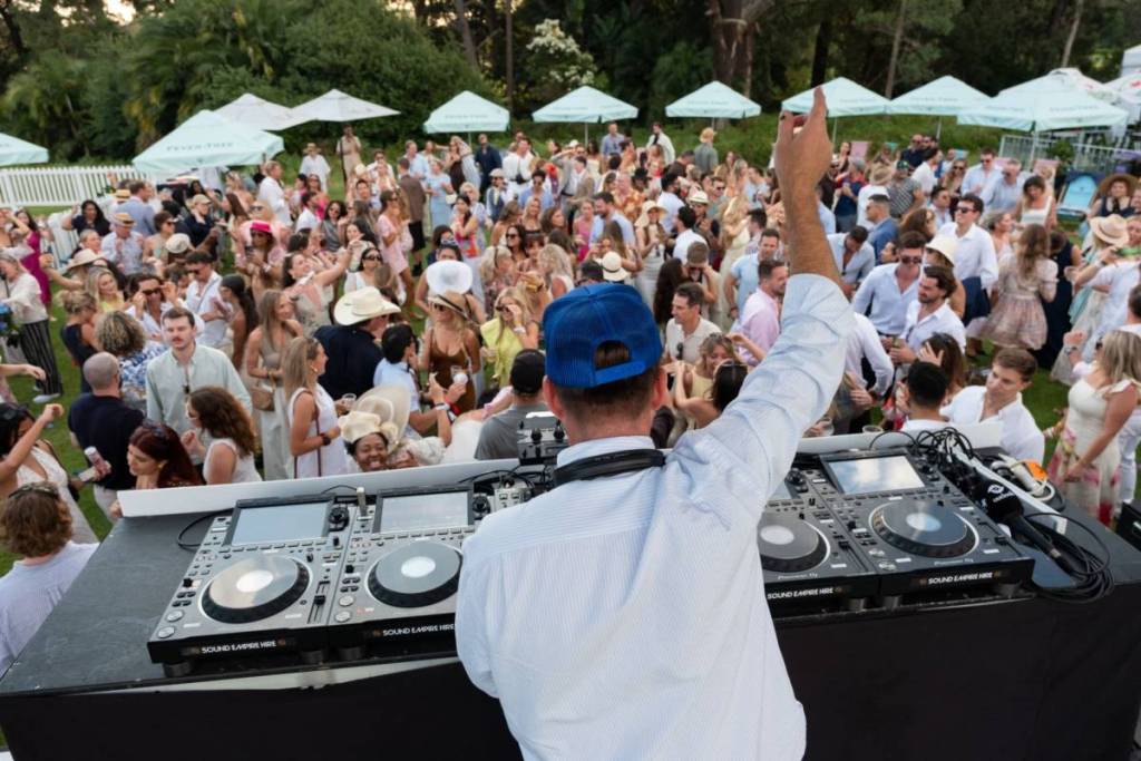 A DJ plays for the crowd at F3 Polo.