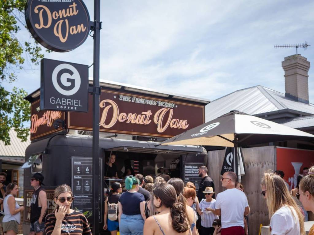 Crowds gather around the famous Berry Donut Van in Berry on a sunny day