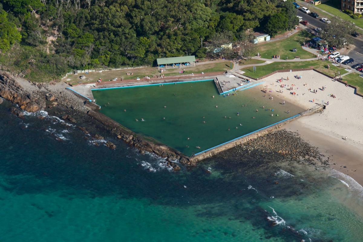 Aerial view of Forster’s ocean baths beside the turquoise waters of the Pacific Ocean