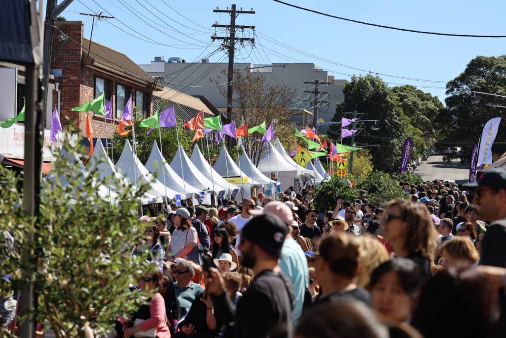 Crowds browsing market stalls at the Love Earlwood street festival in Sydney