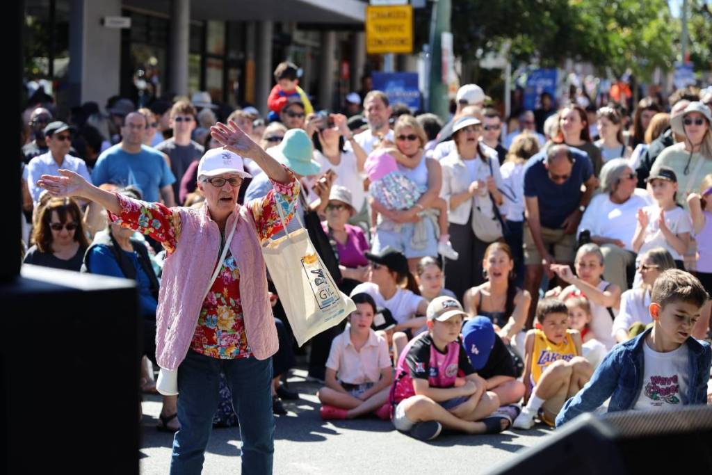Crowds watching live entertainment at the Love Earlwood street festival in Sydney
