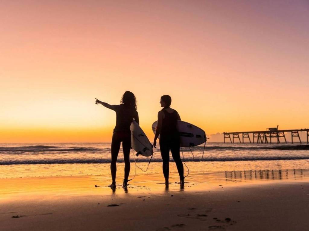 two surfers at catherine hill bay in nsw