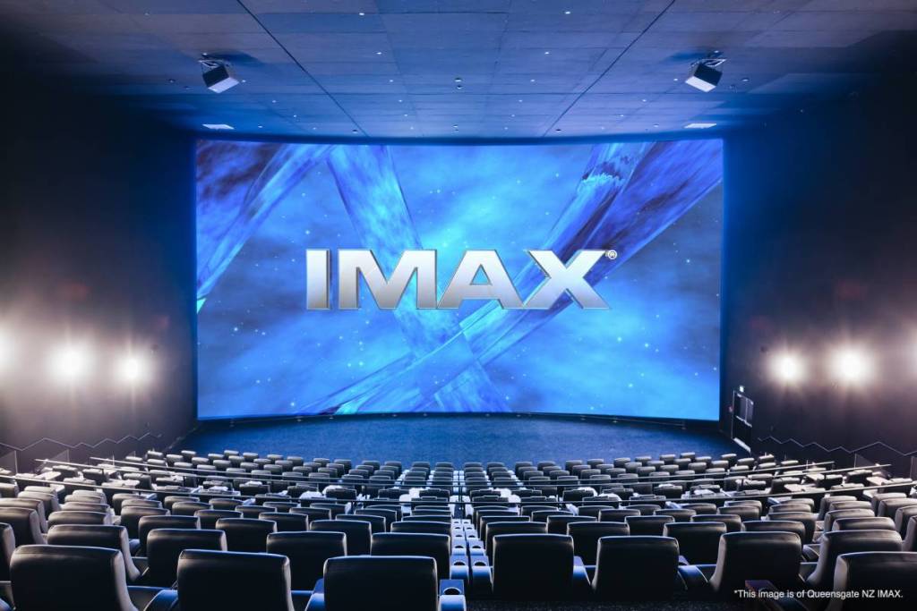 Large IMAX cinema screen overlooking rows of seats inside a modern auditorium