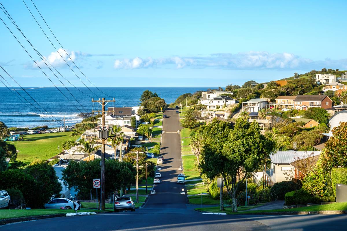Residential street in Gerringong leading towards the blue Pacific Ocean and coastline