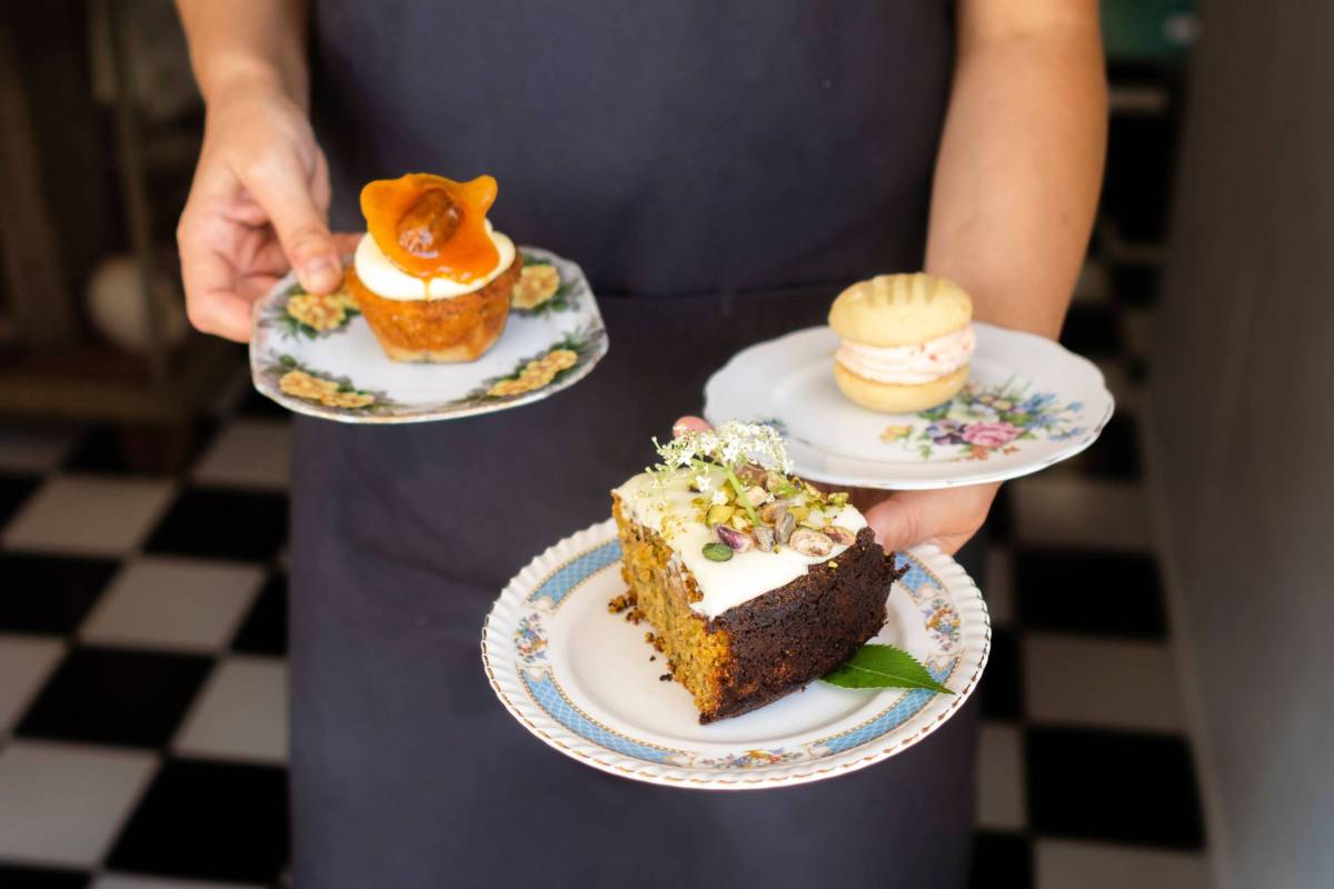 A selection of cakes and pastries served on vintage plates at a cafe in Yamba