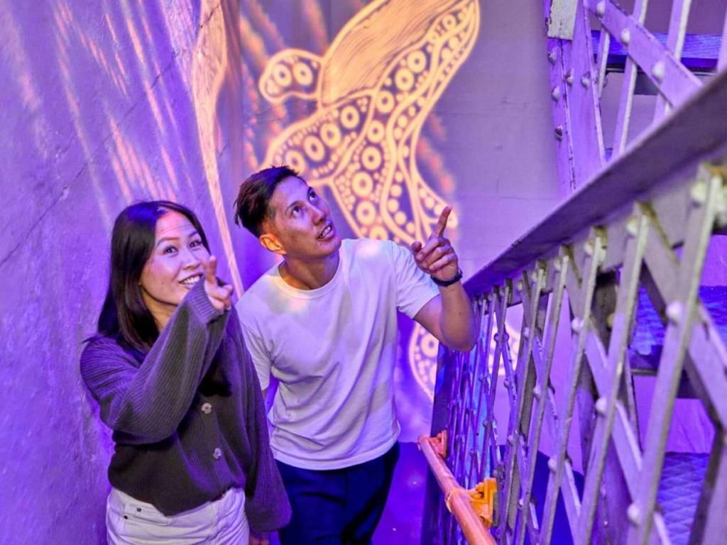 couple walking up 200 stairs at the Sydney Harbour Bridge Museum