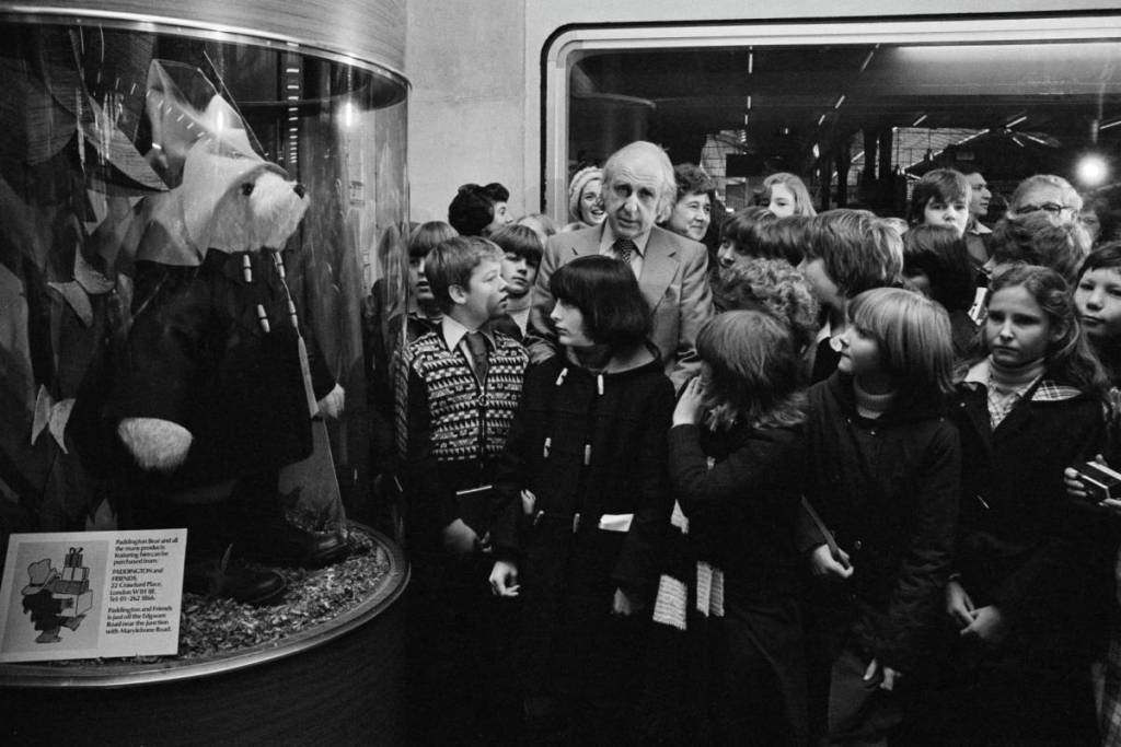 Author Michael Bond with children near paddington