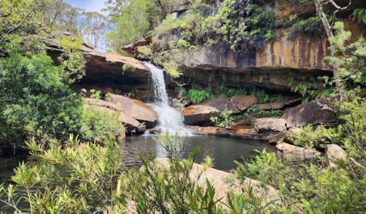 Sydney’s most magical hidden waterfall is just 40 minutes from the CBD — with lush picnic spots, scenic coastal lookouts and waterfront dining nearby