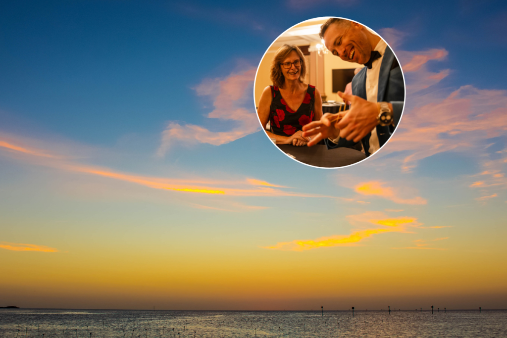 Sunset across Tampa Bay plus a magician doing a magic trick for a guest at Theater of Magic