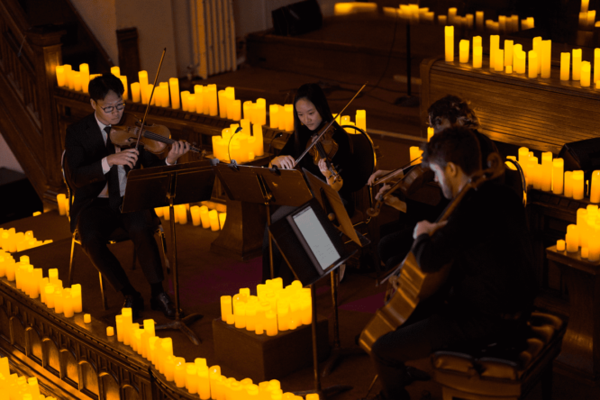 Musicians playing by candlelight