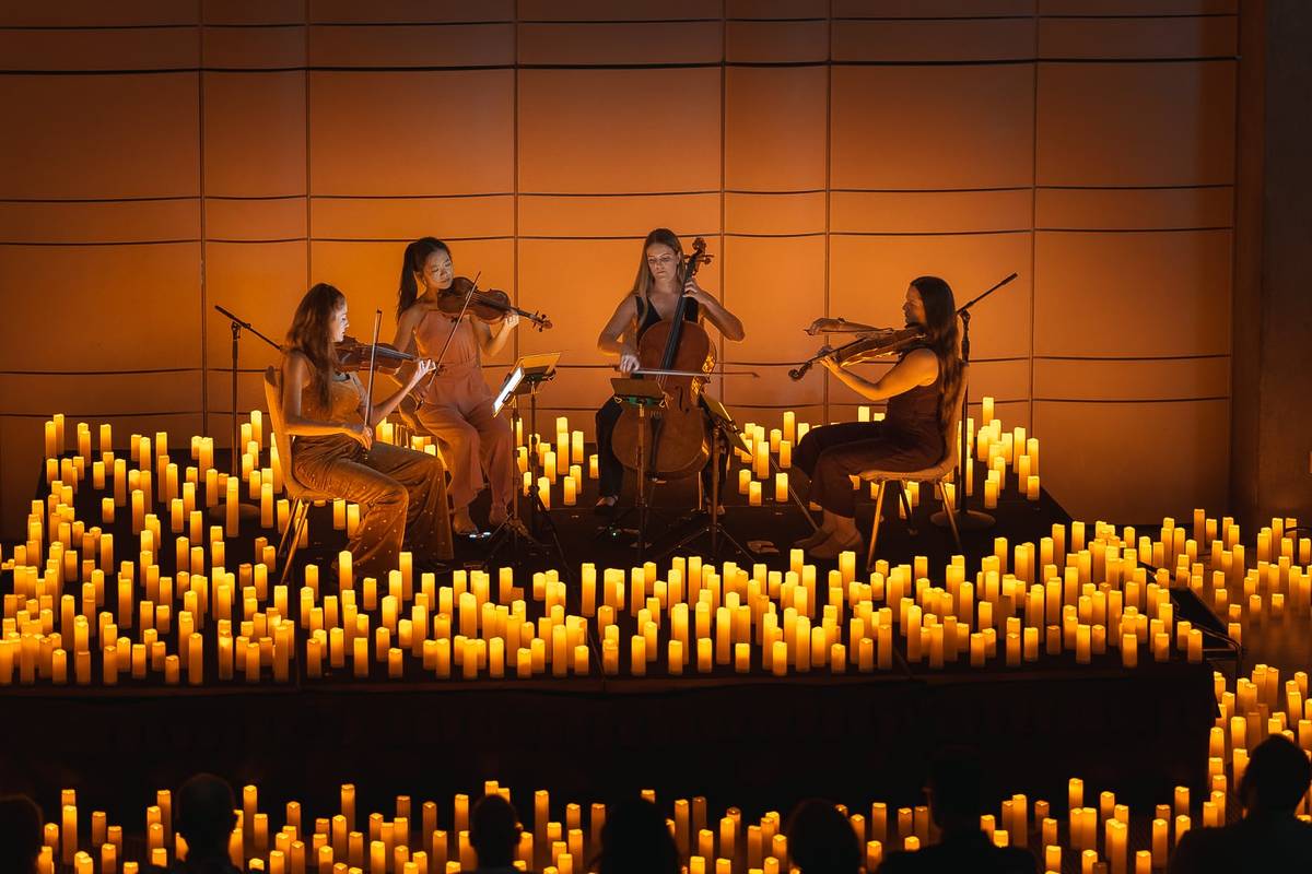 Musicians perform by candles at a Candlelight concert in Los Angeled.