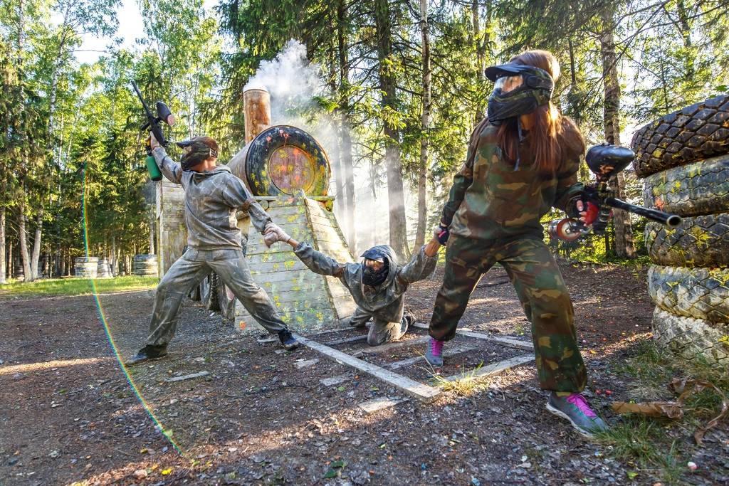 Three friends playing paintball, games in the province of Seville