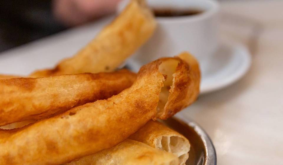 Why are churros called “calentitos” in Seville?
