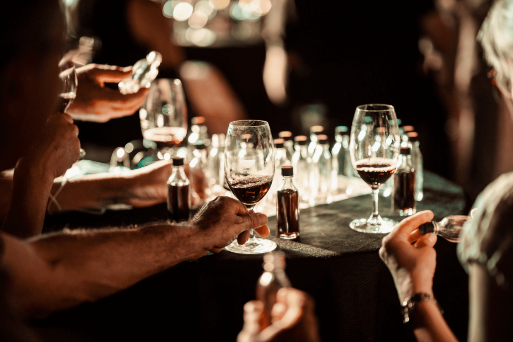An Idiot’s Guide to Wine: glasses of wine at the table and stand-up comedy