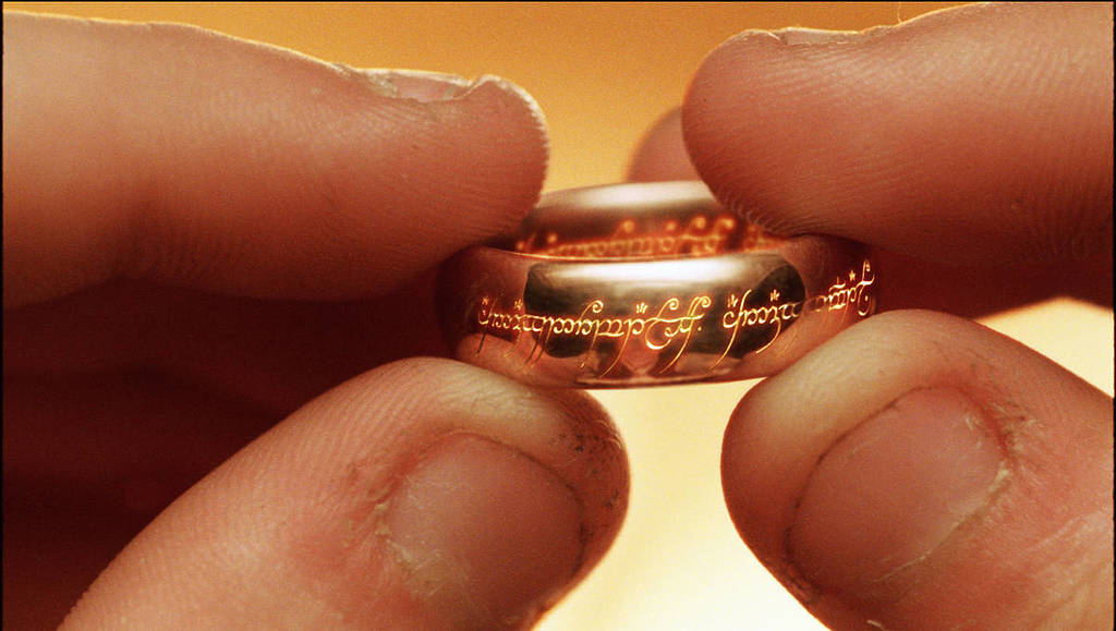 Close-up from The Lord of the Rings, Frodo holding the ring between his fingers