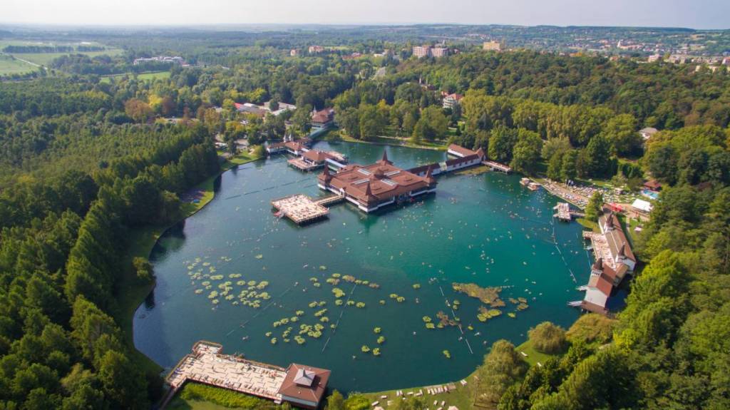 Just 2.5 hours from Vienna lies the world’s largest active thermal lake, spanning 4.4 hectares and featuring a sea of water lilies, while the water springs from a 38-meter-deep cave of volcanic origin